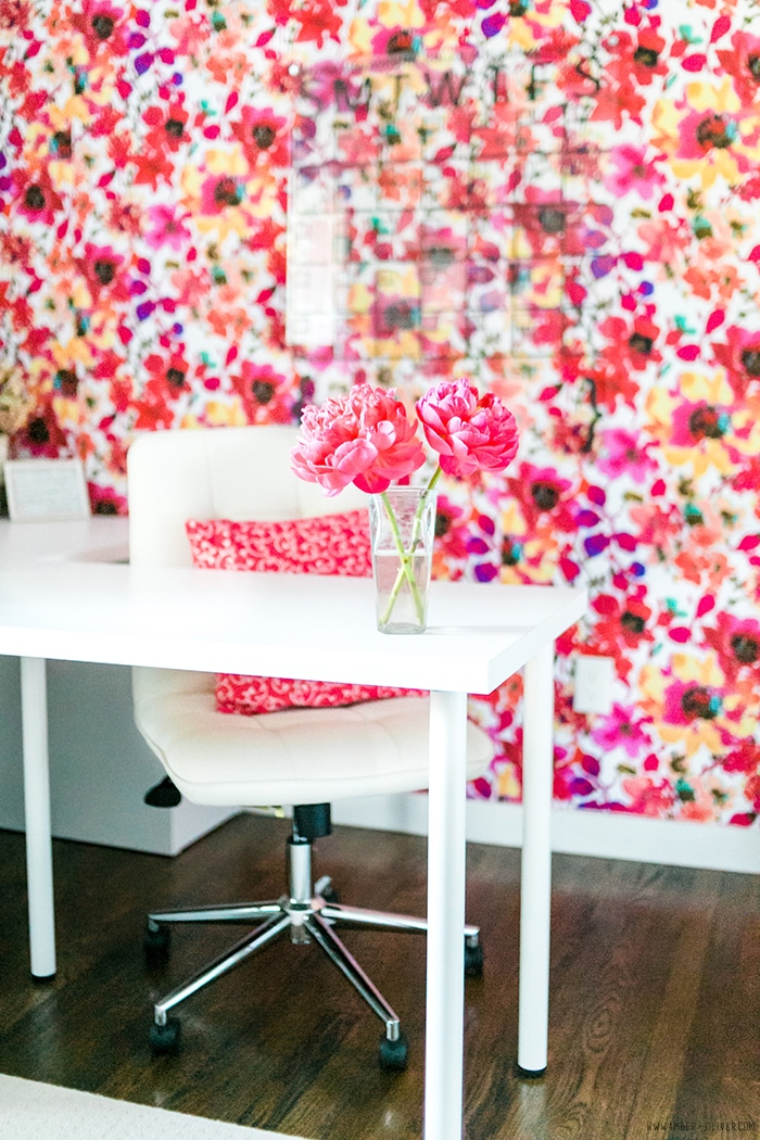 Office Makeover - Amber Oliver. Bright and cheerful office space with floral fabric covered wall. Photo by thinkelysian.com