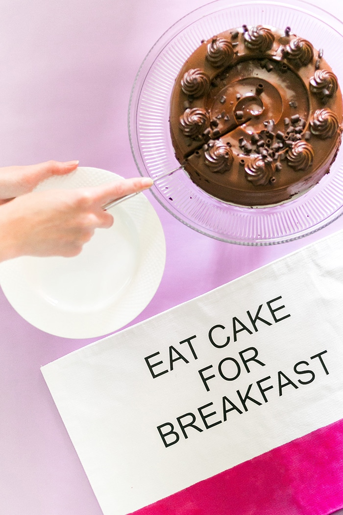 DIY Kate Spade Placemats by Amber Oliver - cutting a chocolate cake