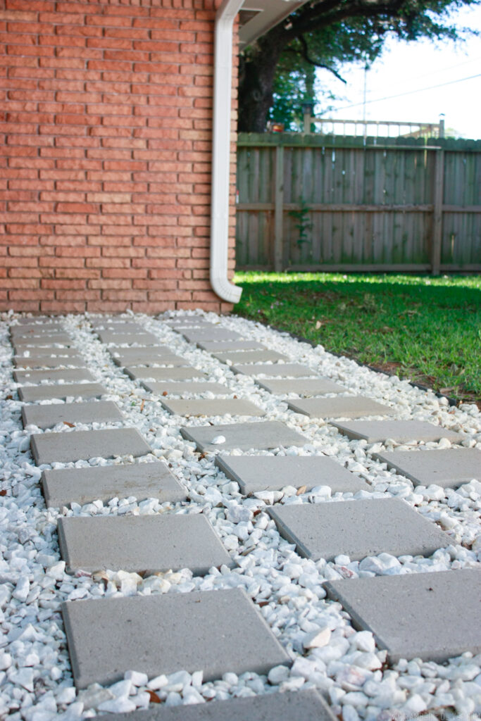 With a shovel, a rake, and some muscles you can learn how to lay patio pavers in one weekend to address a problem area or as a practical no-water alternative to a lawn.