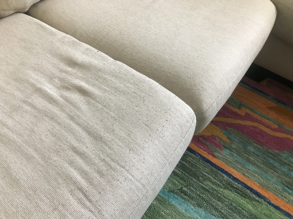 Not ready to replace your fabric couch? You can use a sweater shaver to remove pilling from upholstery to make your couches look new again!