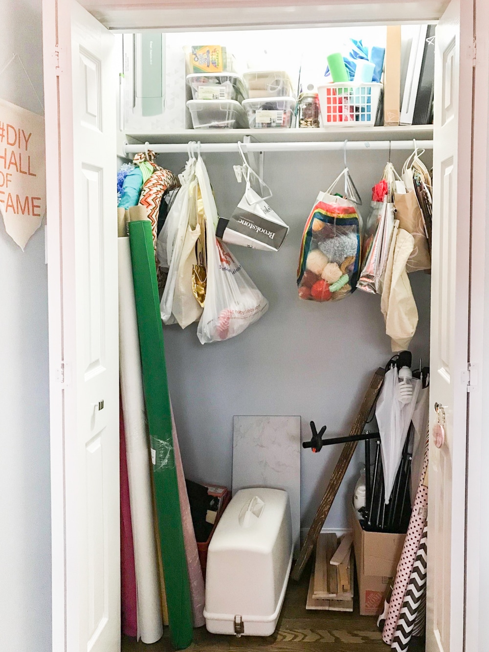 Messy craft closet before we built DIY closet shelves