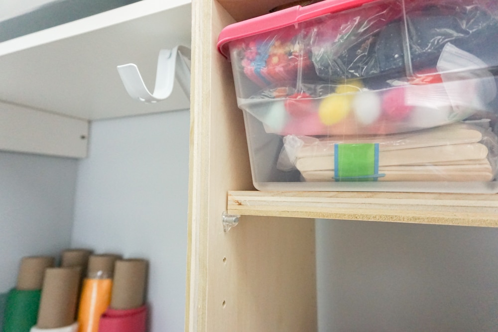 Close up of DIY closet shelves - perfect craft closet organization idea!