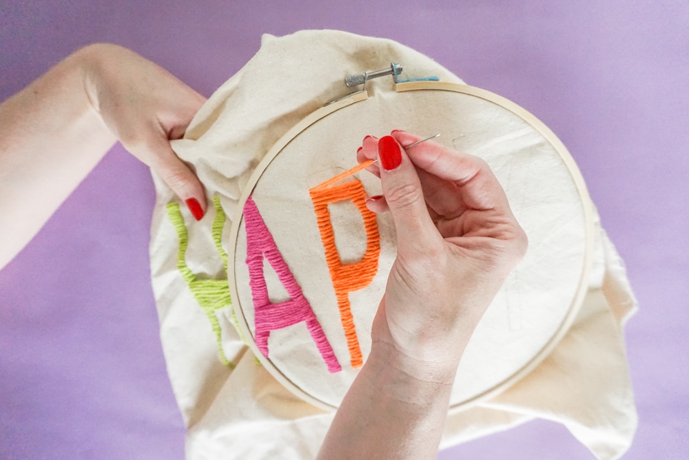 close up of doing Yarn Embroidery: How to Embroider Letters (A HAPPY DIY Tote Bag)