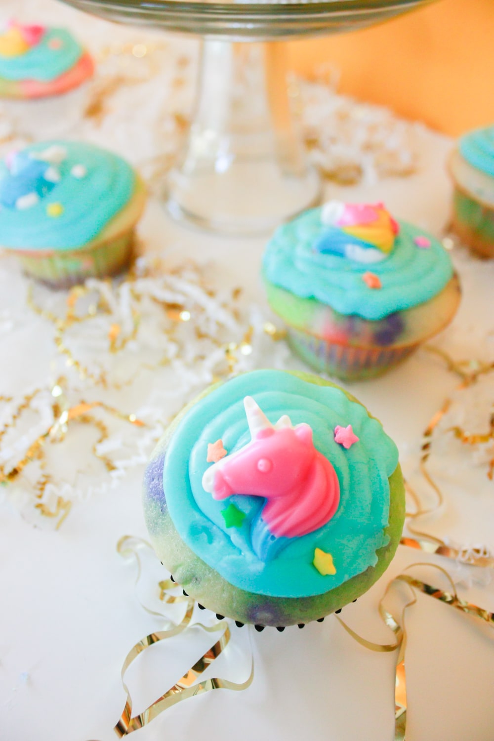 Unicorn cupcakes with unicorn candy and easy homemade icing!