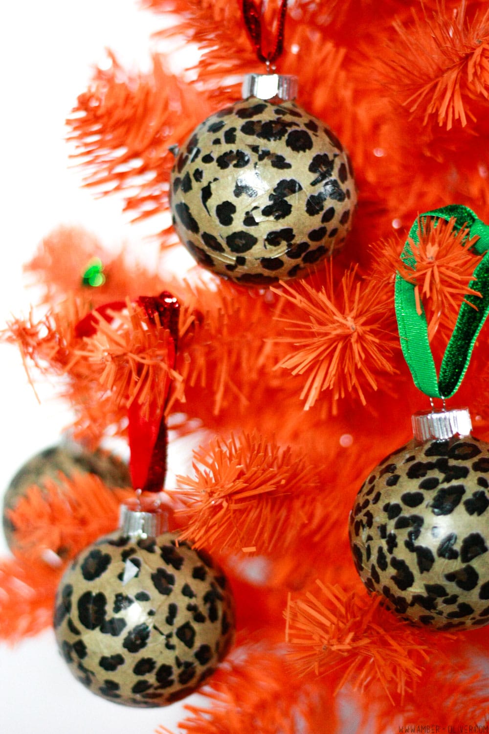 close up view of DIY Leopard Print Ornaments - easy to make modge podge tissue paper Christmas ornaments!