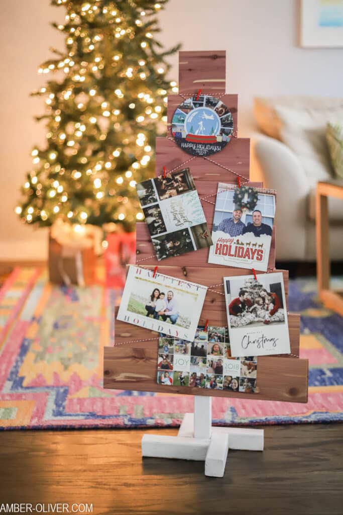 cedar DIY Christmas card holder with holiday cards on it