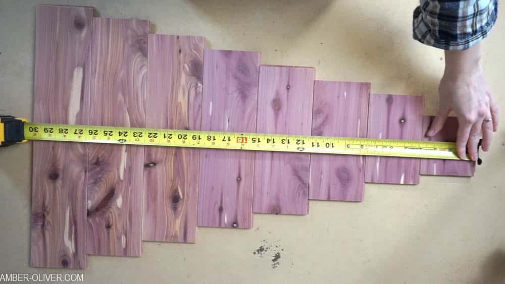 measuring cedar planks to decide how tall the Christmas Card holder is