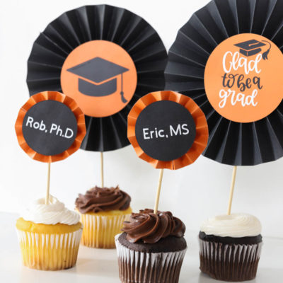 graduation DIY cupcake toppers made with paper rosettes from the Cricut Maker