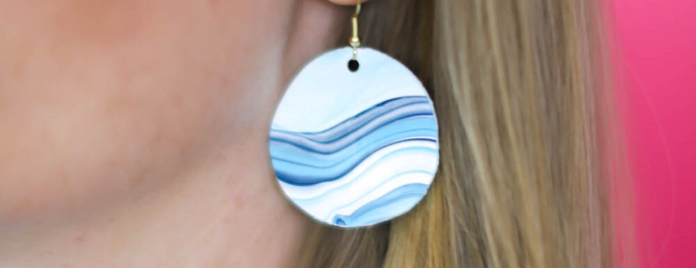 close up of DIY earrings made from an acrylic pour painting
