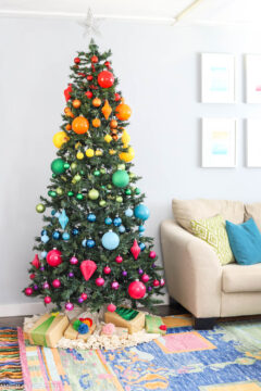 rainbow christmas tree in colorful living room