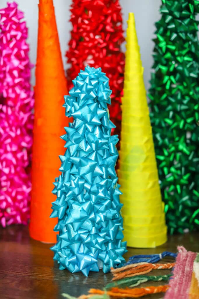 blue bows covering a cone christmas tree
