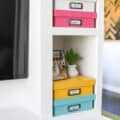 colorful diy memory boxes stacked in a DIY entertainment center