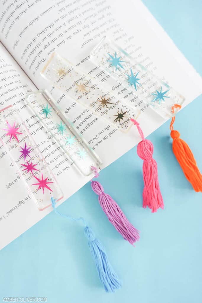 colorful diy bookmarks in a book with colorful tassels on the ends