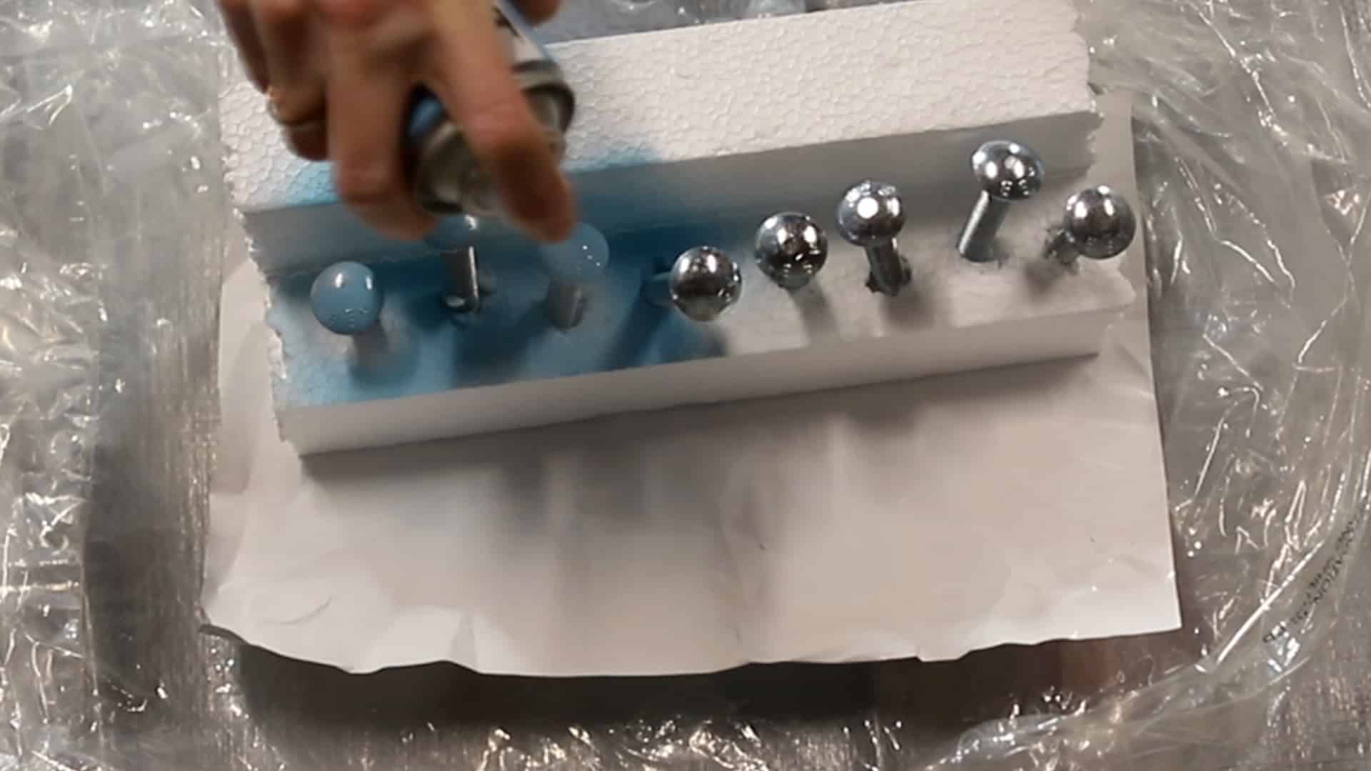 spray painting bolts for DIY blanket ladder