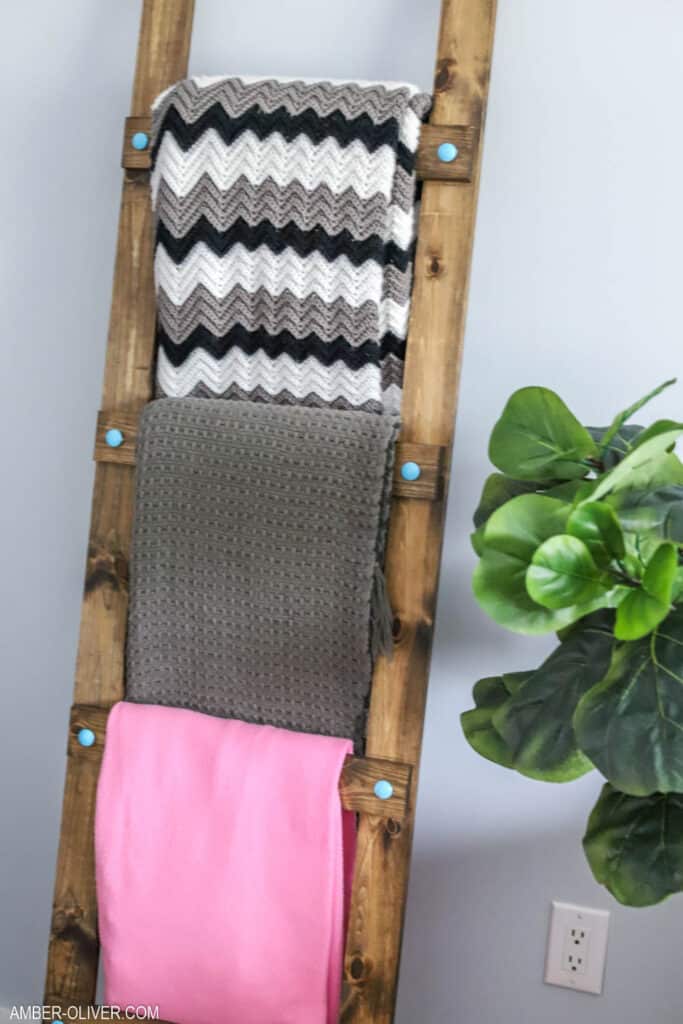diy blanket ladder leaning on a wall