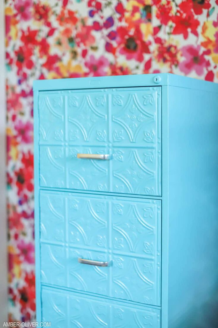 close up of a DIY filing cabinet makeover painted with blue paint