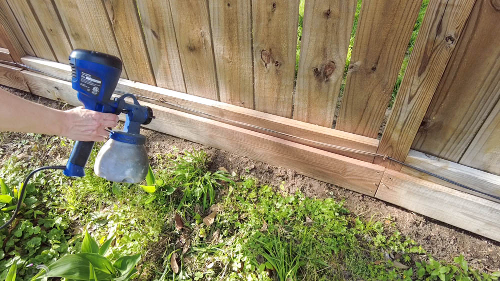 how to stain a fence and protect plants and grass