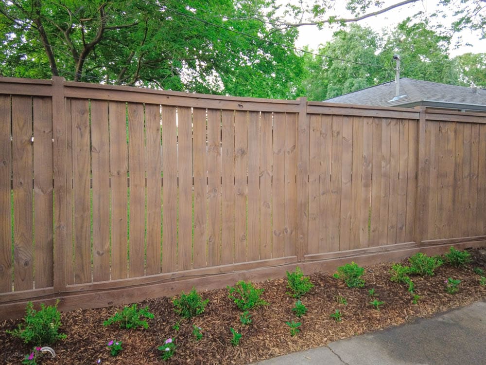 our DIY wood fence with wood stain