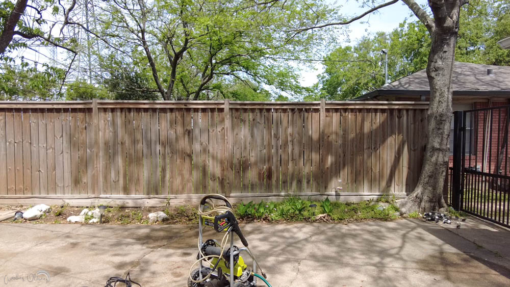 DIY wood fence before using a paint sprayer to add wood stain