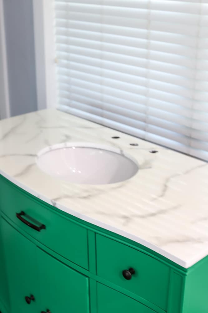 full view of painted bathroom vanity with a diy painted faux marble countertop