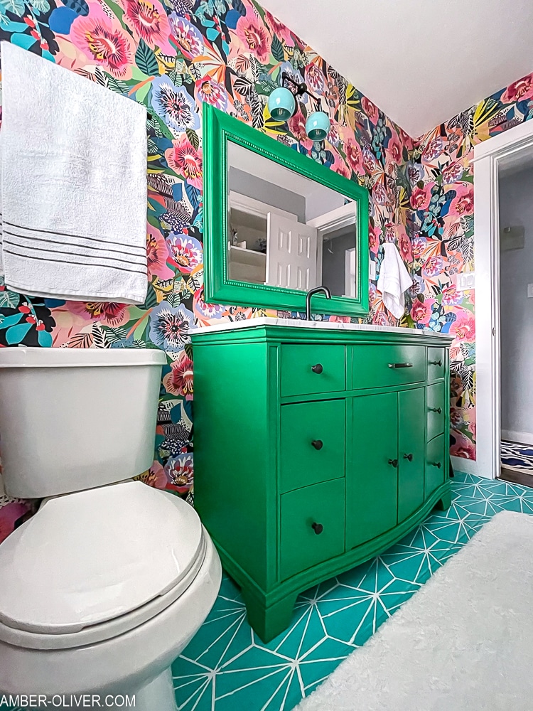 painted green vanity in bold bathroom