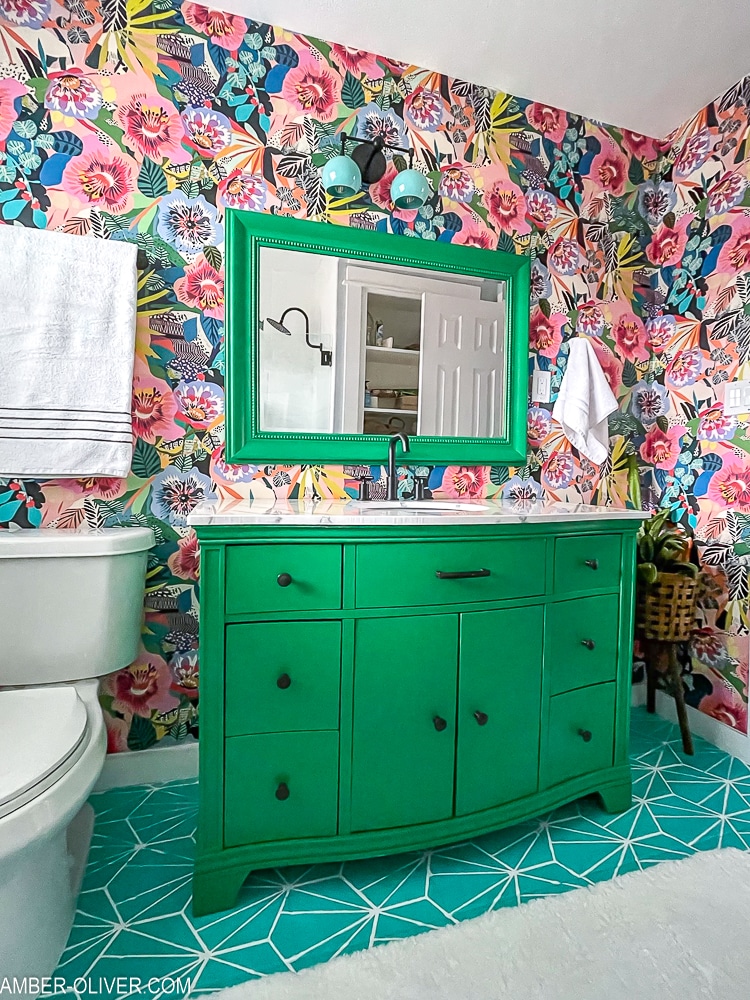 view of vanity in front of bold wallpaper