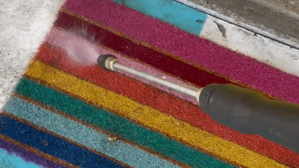 spring outdoor cleaning of rugs with powerwasher