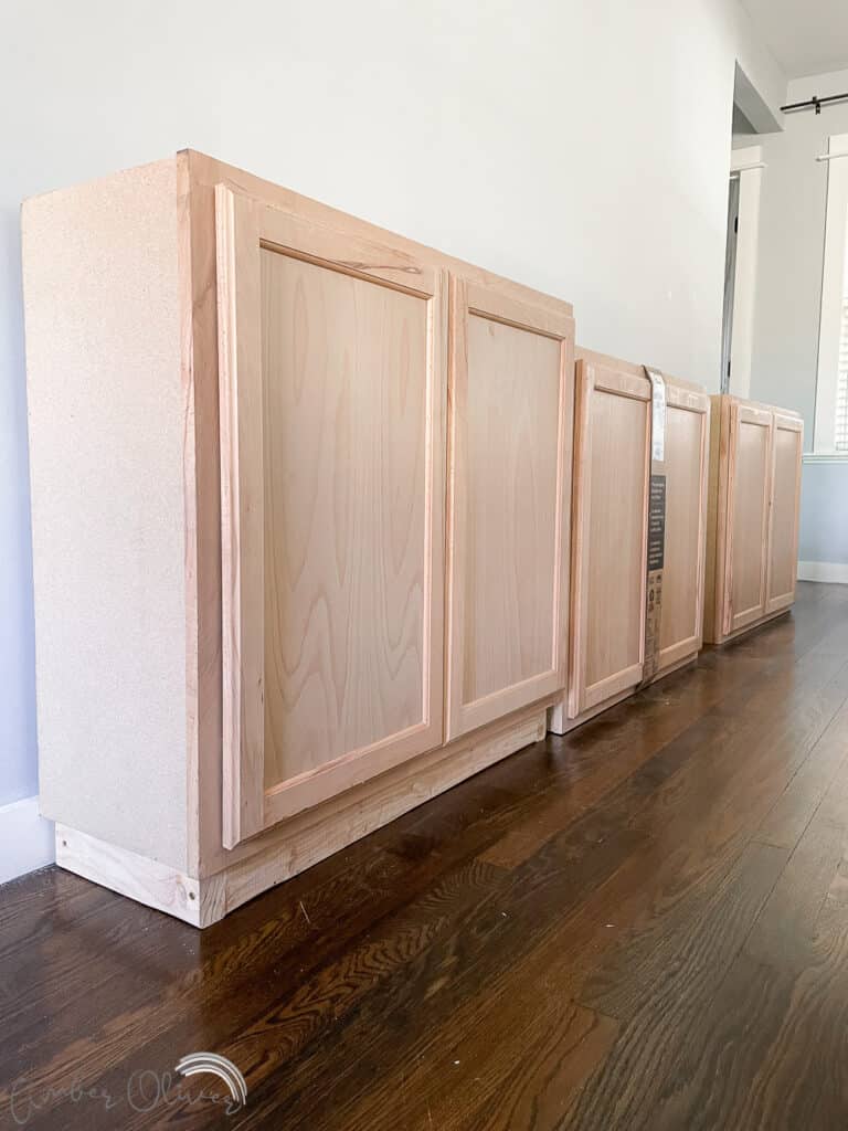 Rainbow DIY Bookshelf with Built in Cabinets - Amber Oliver