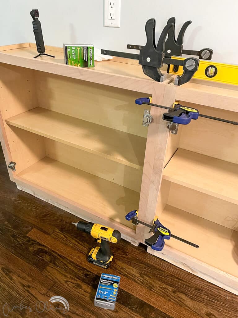 Rainbow DIY Bookshelf with Built in Cabinets - Amber Oliver