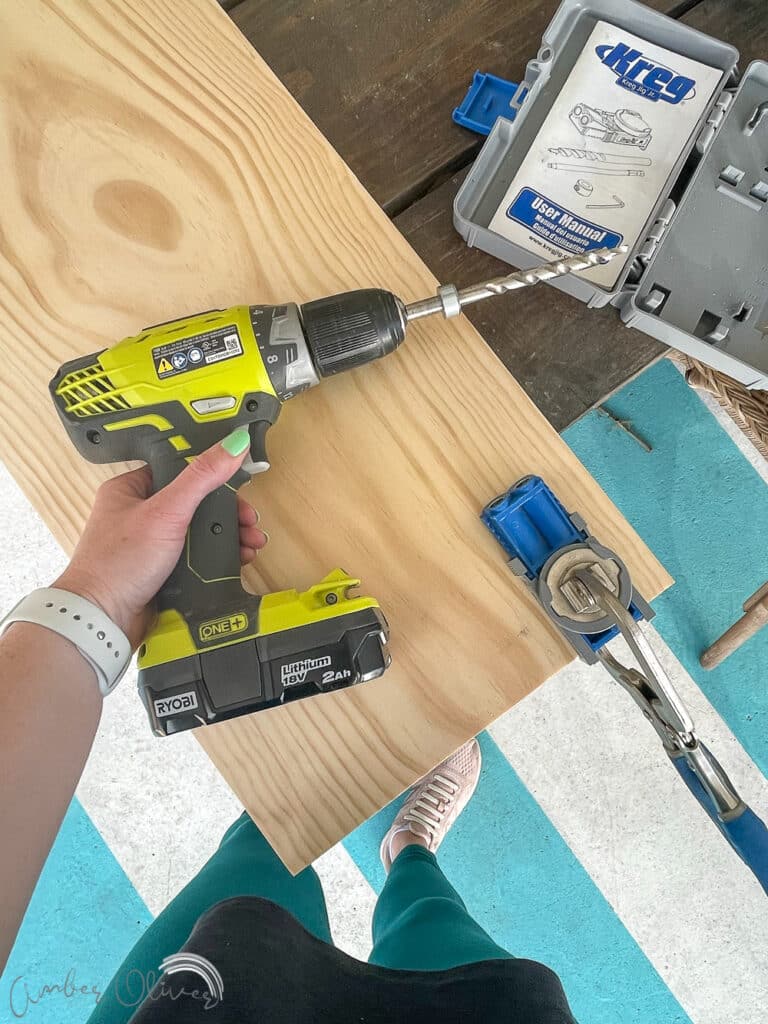 drilling pocket holes to attach diy bookshelf into built in cabinets