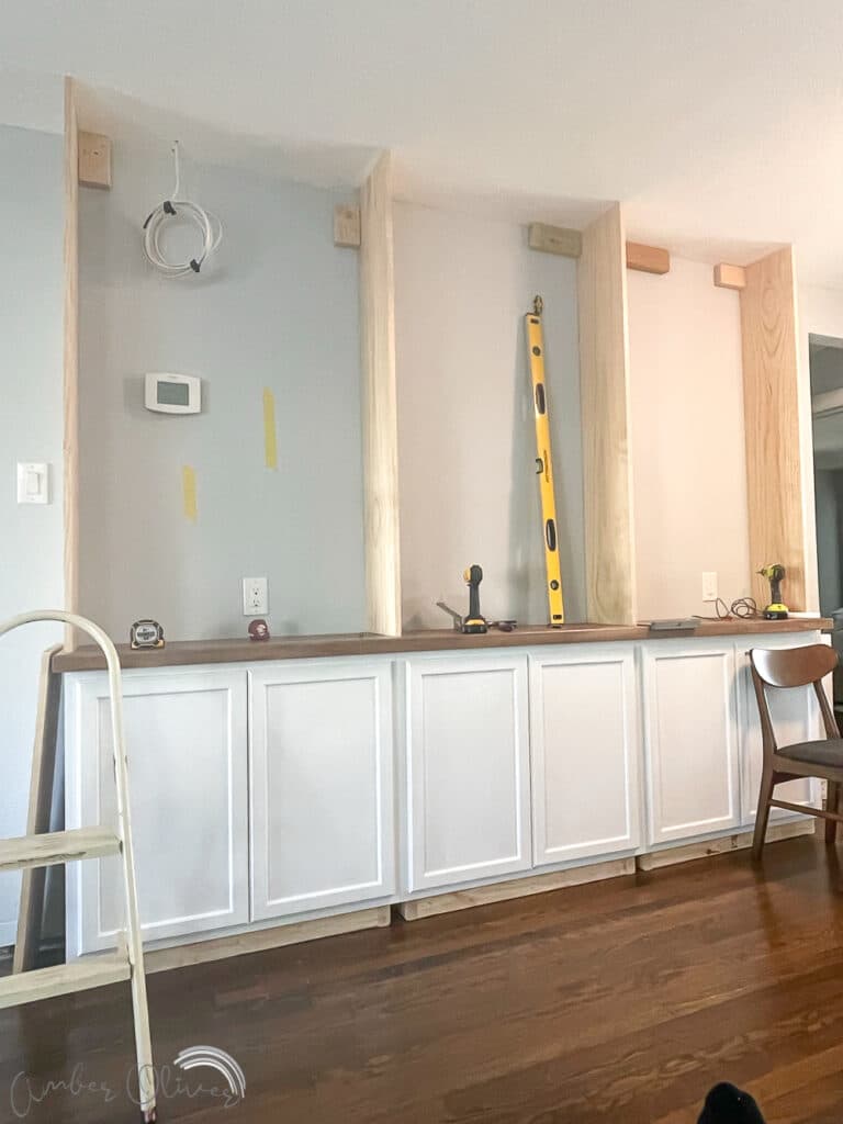 Rainbow DIY Bookshelf with Built in Cabinets - Amber Oliver