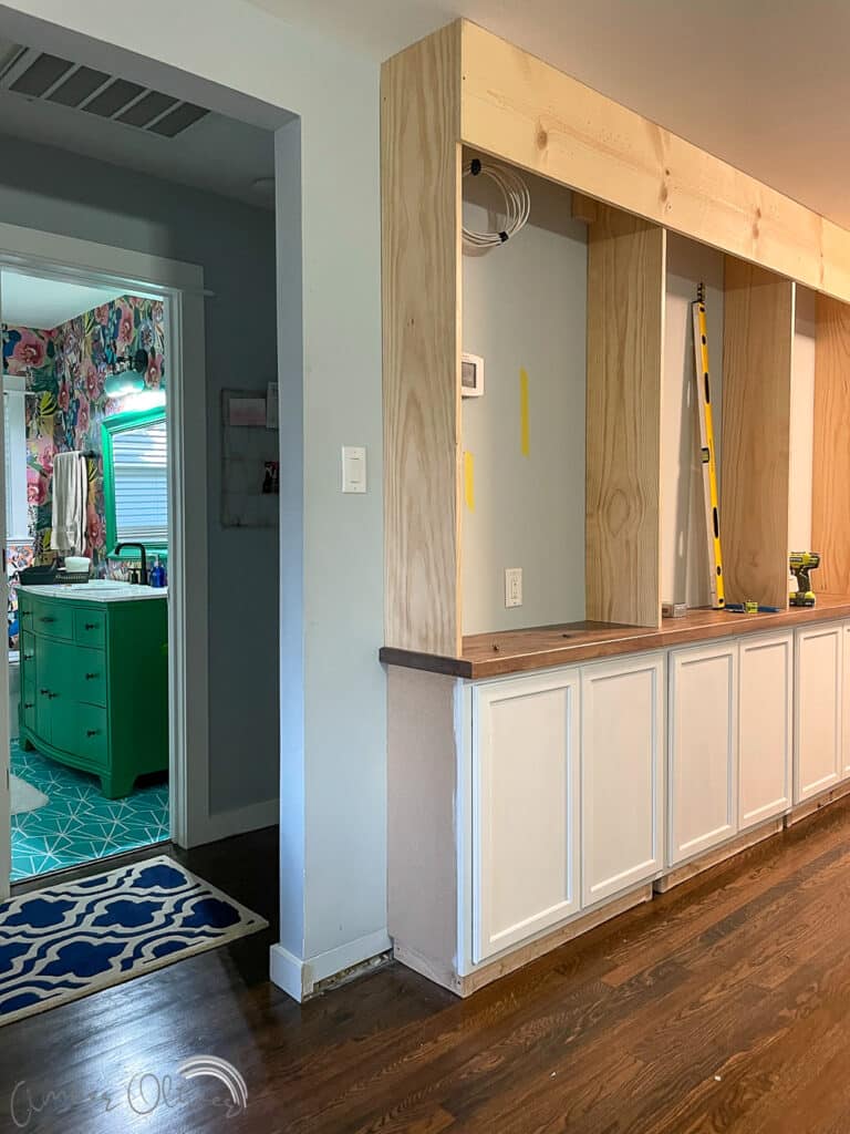 Rainbow DIY Bookshelf with Built in Cabinets - Amber Oliver