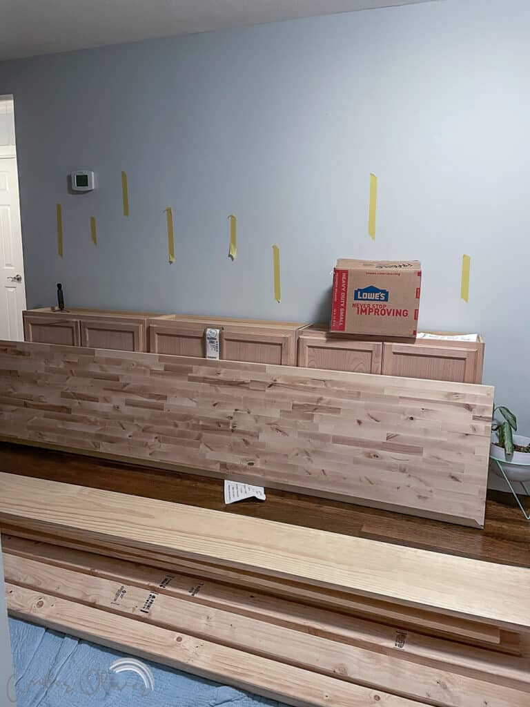 https://amber-oliver.com/wp-content/uploads/2022/06/DIY-Bookshelf-with-Built-in-Cabinets-3-768x1024.jpg