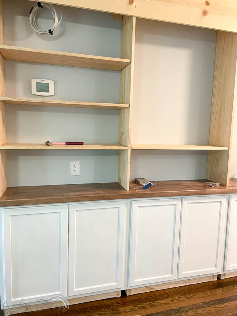 Rainbow DIY Bookshelf with Built in Cabinets - Amber Oliver