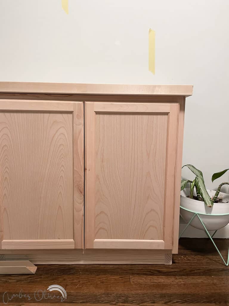 Rainbow DIY Bookshelf with Built in Cabinets - Amber Oliver