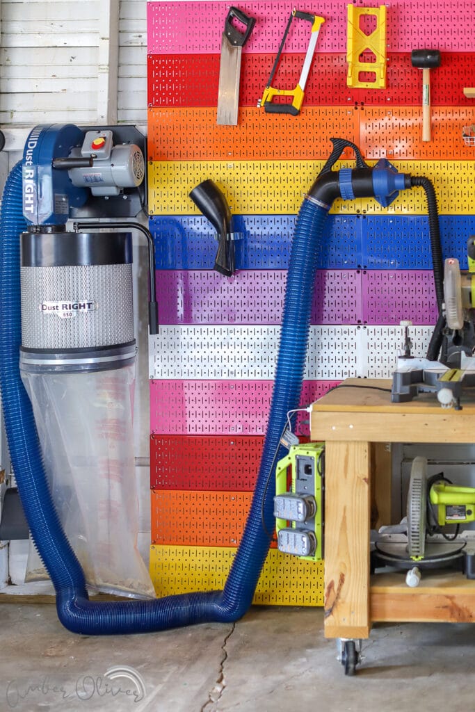 full view of the rockler dust collection system in Amber Oliver's colorful garage