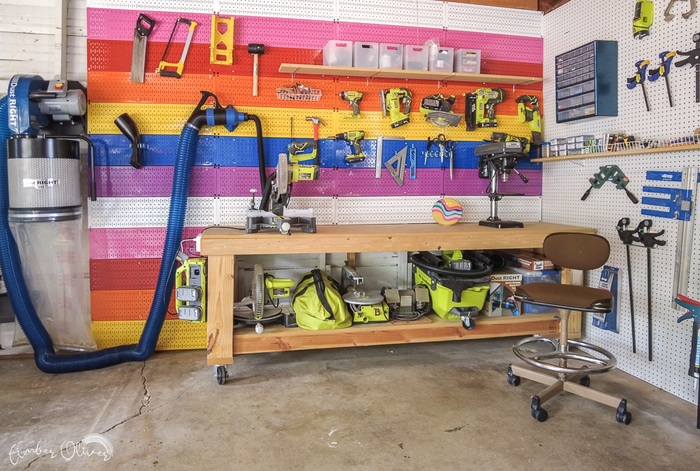 full view or organized garage with rainbow pegboards and rockler dust collector