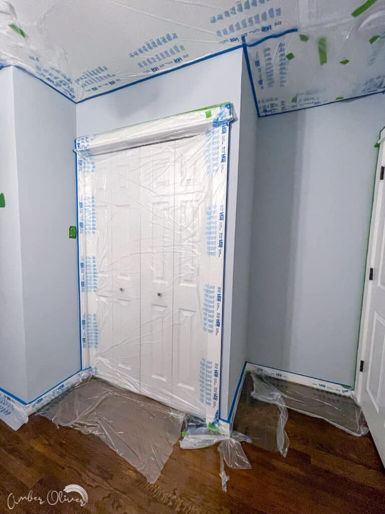 room taped off to use a paint sprayer for walls