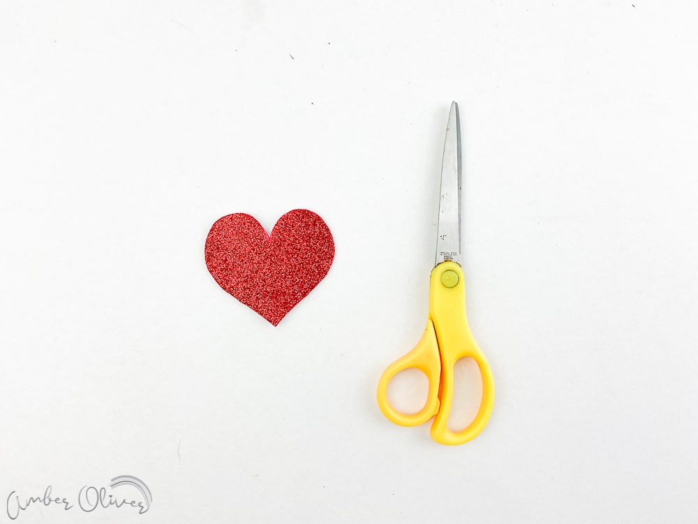 cutting hearts for valentines day garland diy project