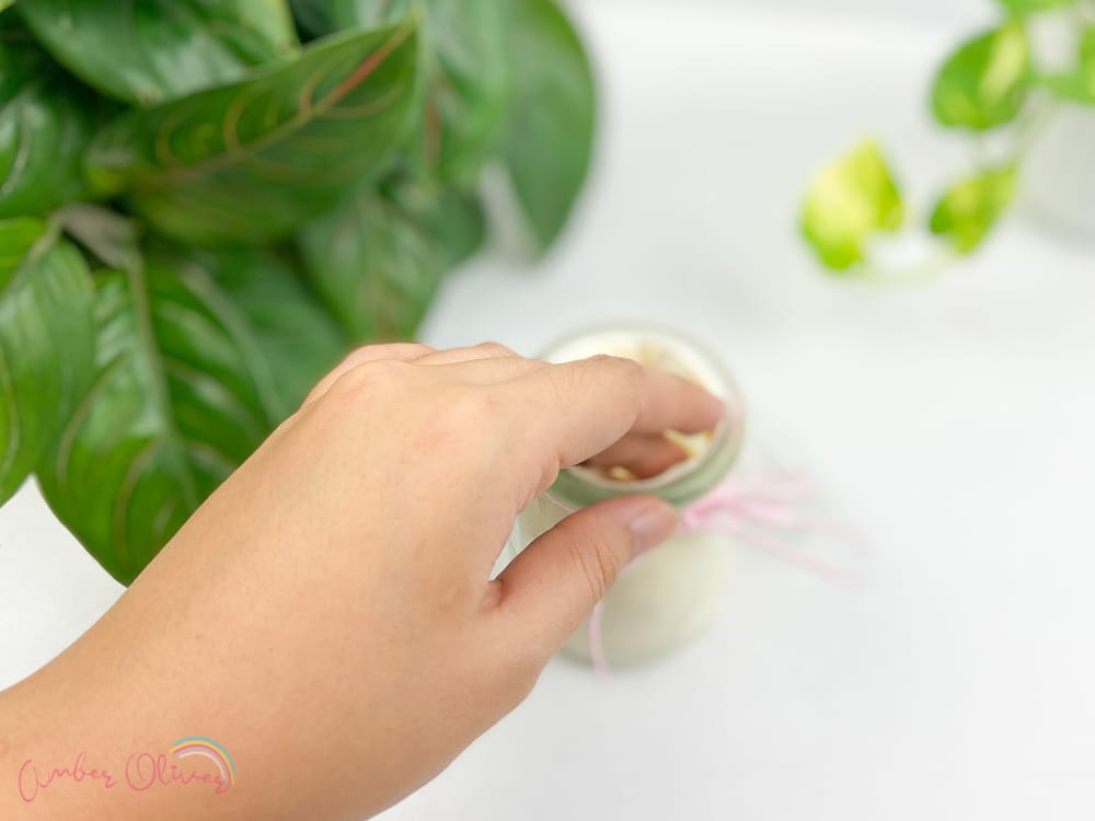scooping diy whipped lotion for a jar
