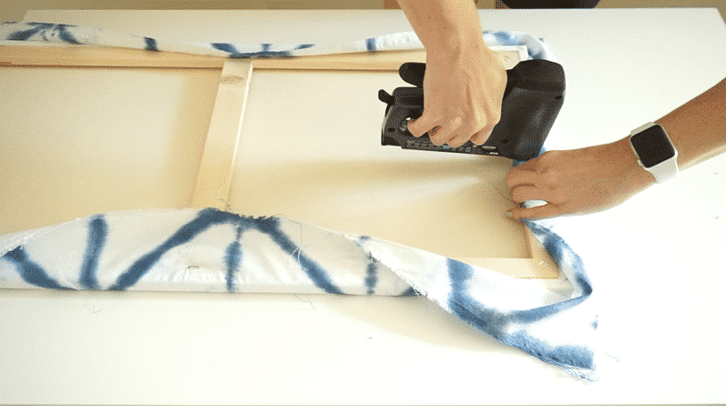 staple shibori fabric to canvas for diy wall art