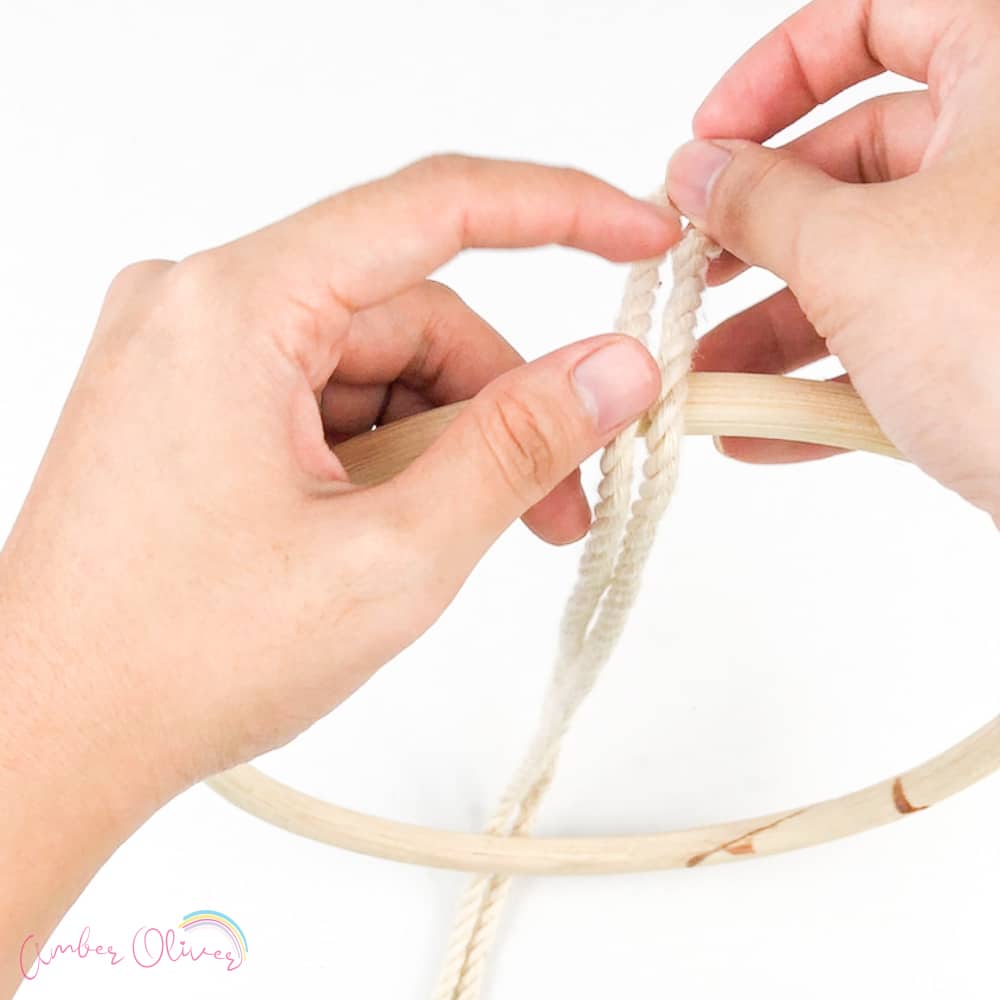 Join the ends of the macrame cord together, folding in half.